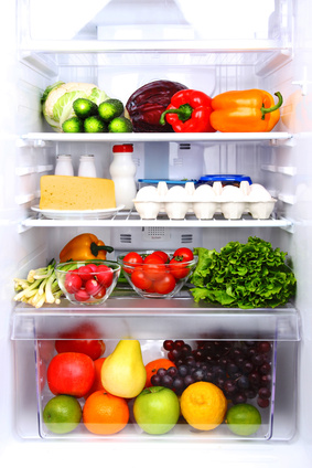 a refrigerator filled with dairy products and vegtables
