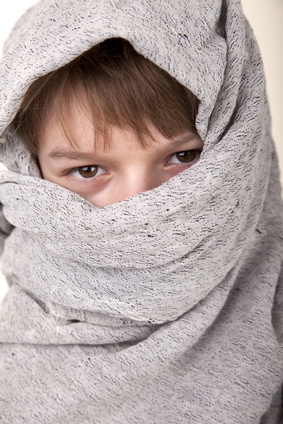 a kids wearing an improvised costume
