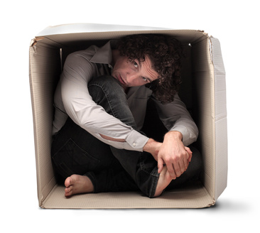 a man inside a cardboard box