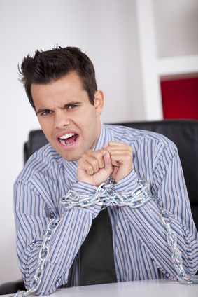 Are we modern slaves? a businessman in chains