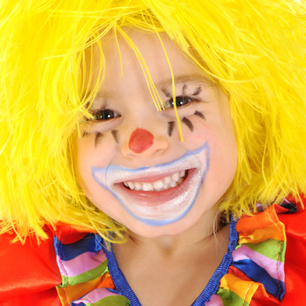 a kid dressed as a clown for Purim