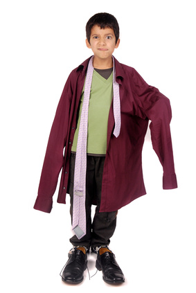 a small boy wearing oversized clothing items