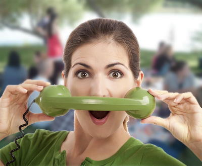 girl using a phone receiver for a mustache