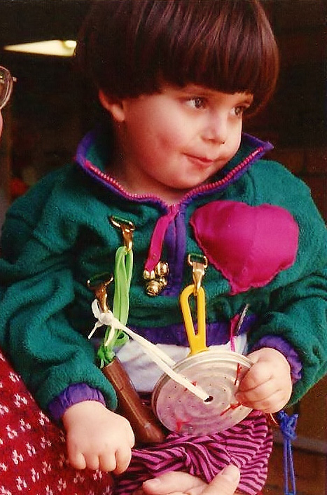Kid dressed up as a Purim noisemaker - raashan