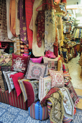 a shop with pillows and tapestries