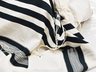 a tallit (prayer shawl)